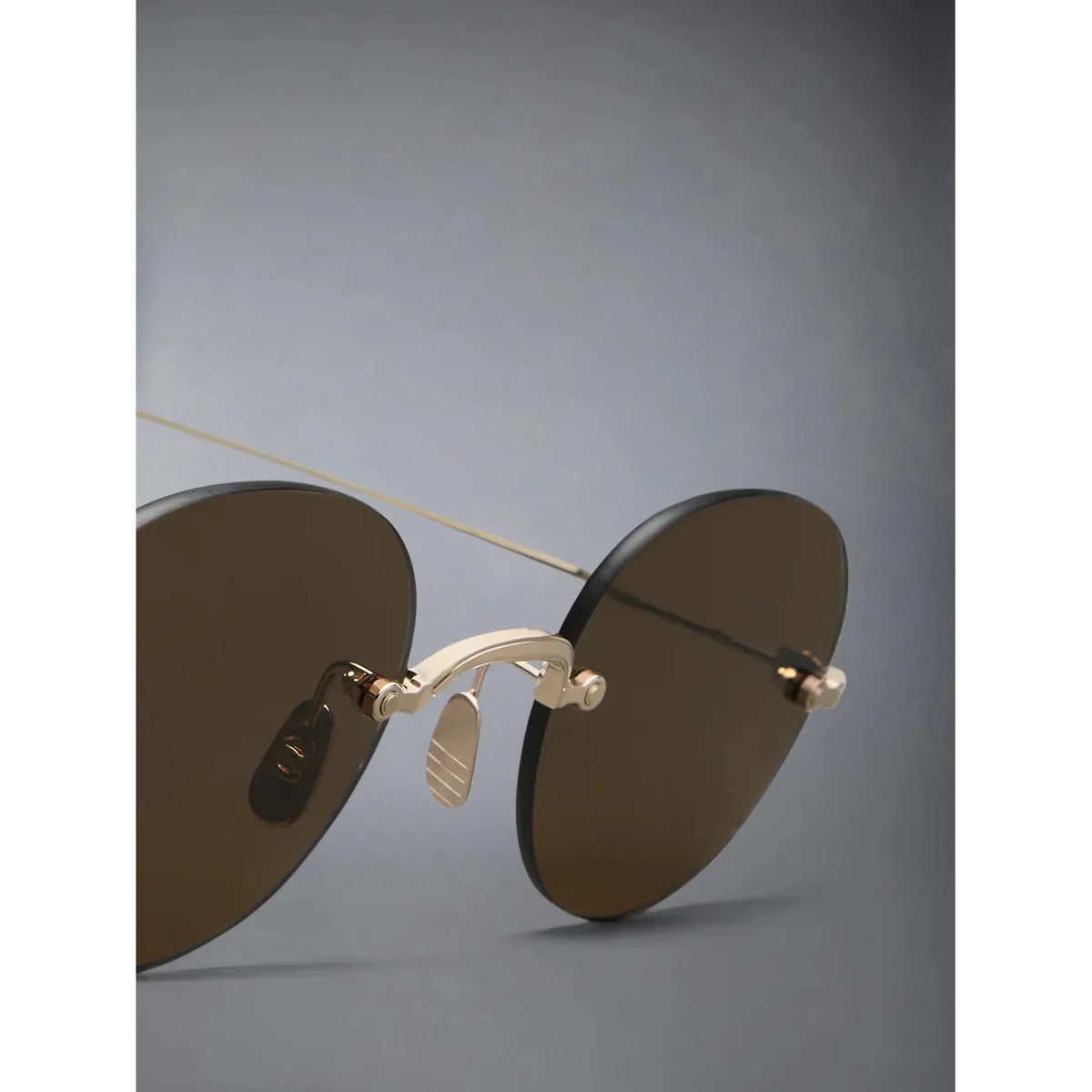 Rimless Round Sunglasses in Titanium - Point of U. | Boston